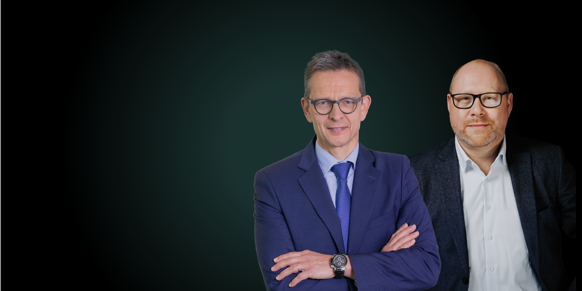 A smiling man dressed in suits